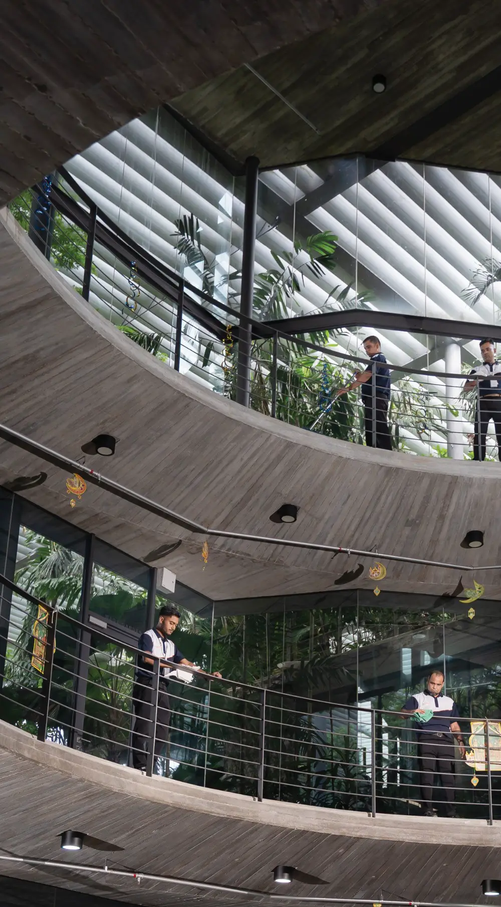 Jaringan Jaya crew servicing a multi-storey corporate atrium