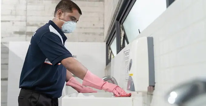 Machine scrubbing of a facility walkway