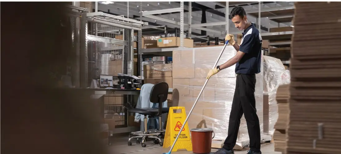 Deep cleaning works inside a logistics warehouse